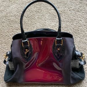 Black, maroon, and gold Fendi hand bag.
